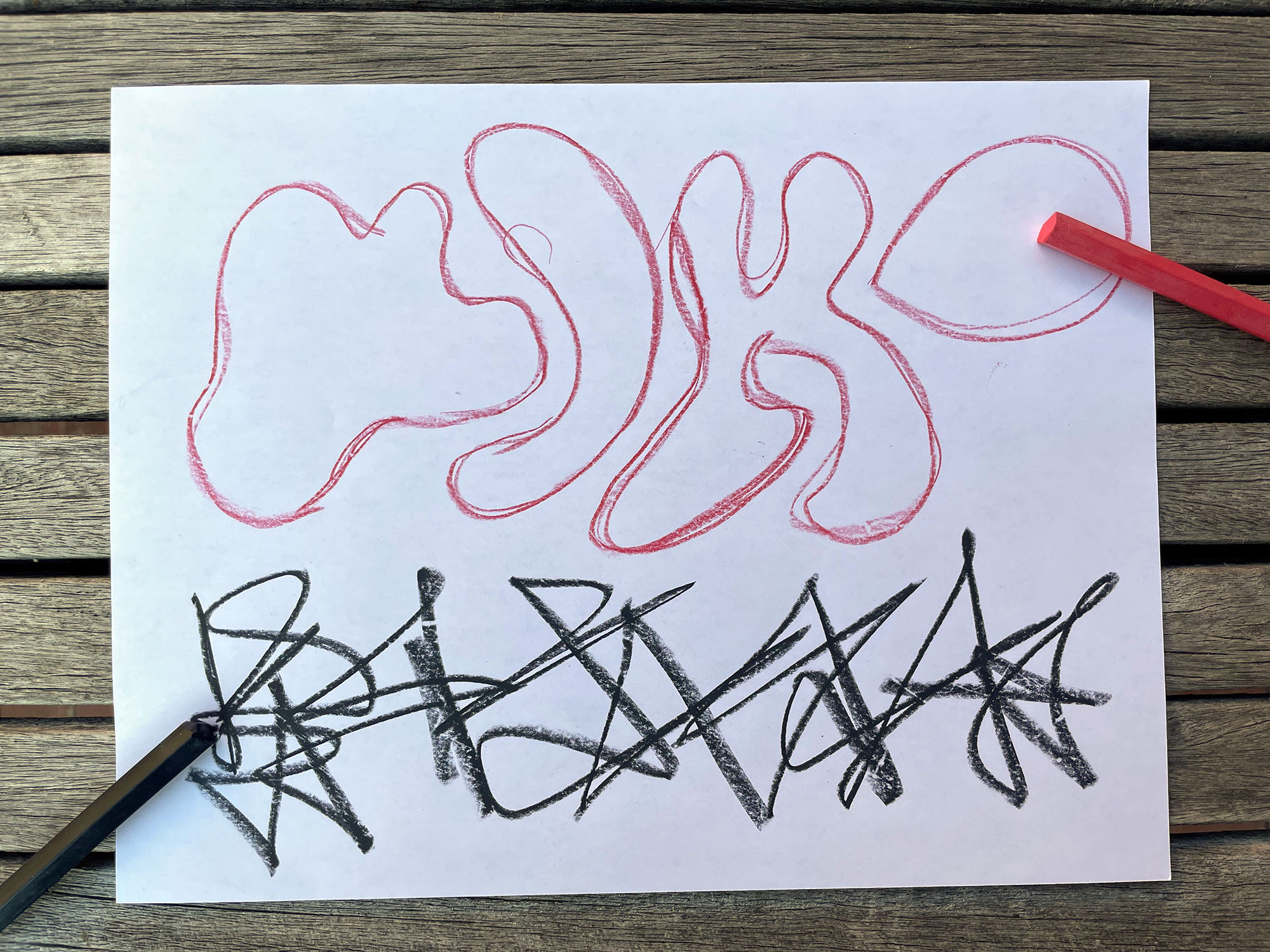 black and red line drawing on white paper