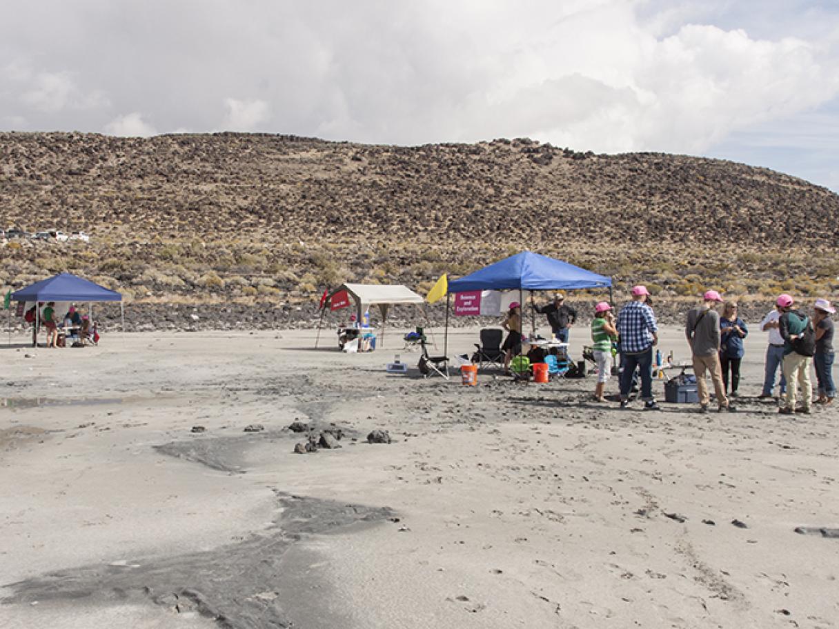 families gather at the Spiral Jetty at a Utah museum of Fine Arts meetup in 2015