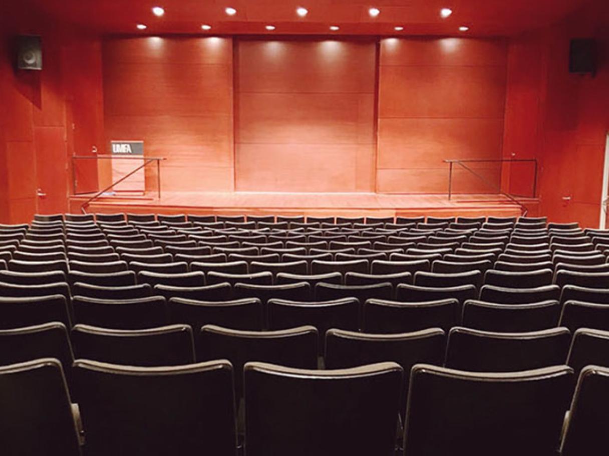 Auditorium with modern wooden stage at UMFA