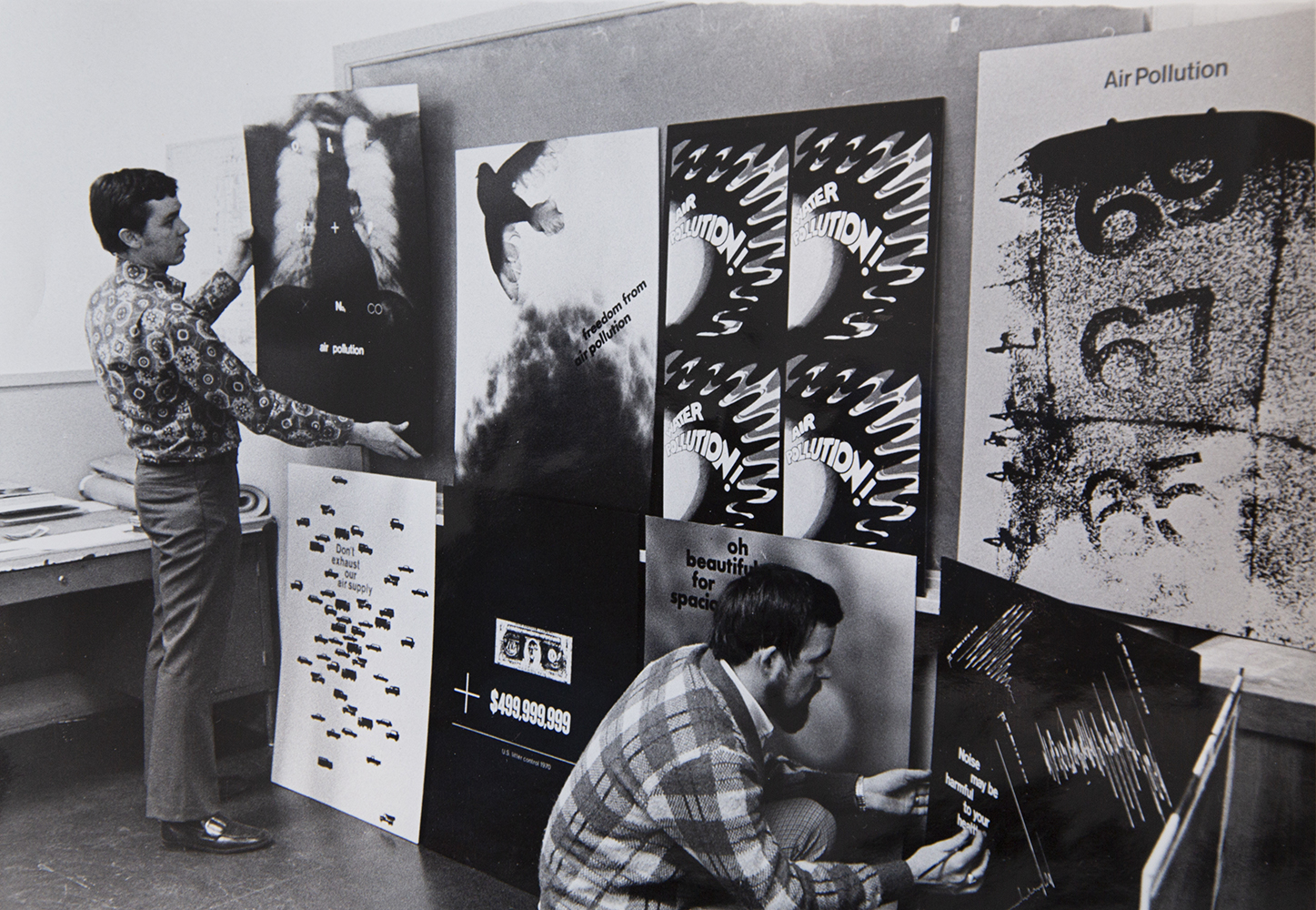 Graphic design students display their anti-pollution poster designs, 1970. University of Utah Archival Photograph Collection P0305, D – Art 1970-1979, Folder 1, No. 3. Special Collections, J. Willard Marriott Library, the University of Utah.    