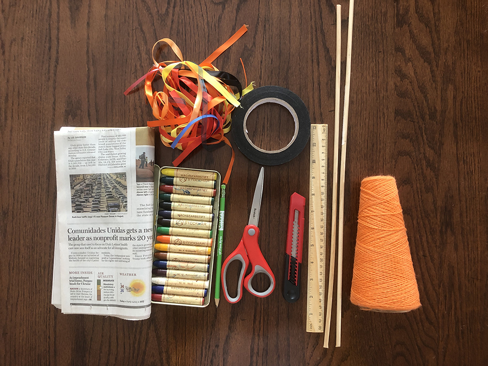 Kite making supplies laid our in a line