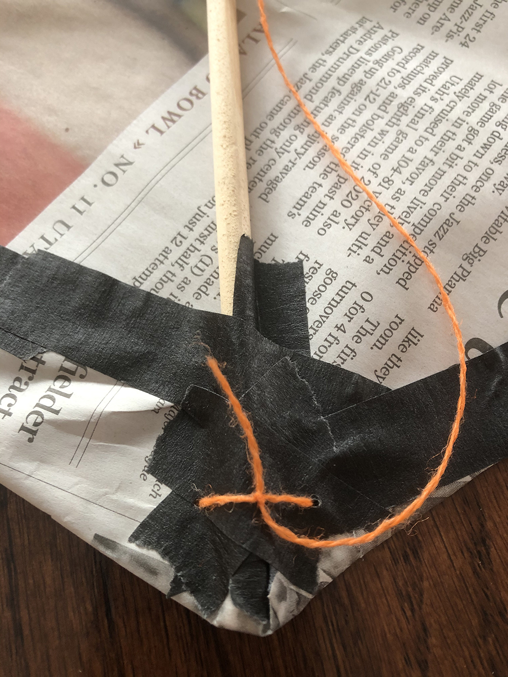 bottom tip of kite with string secured 
