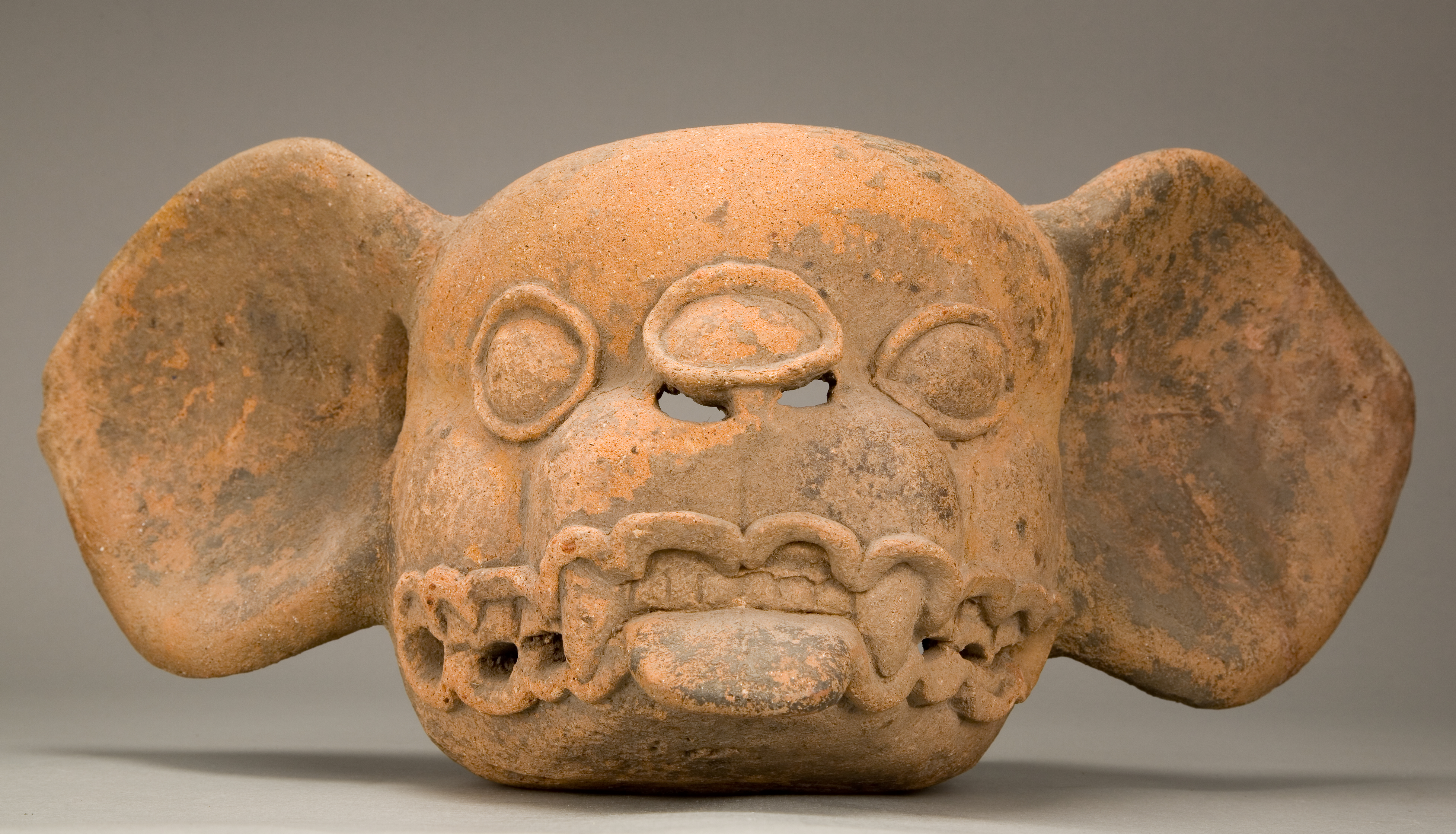 An earthenware bat head effigy.