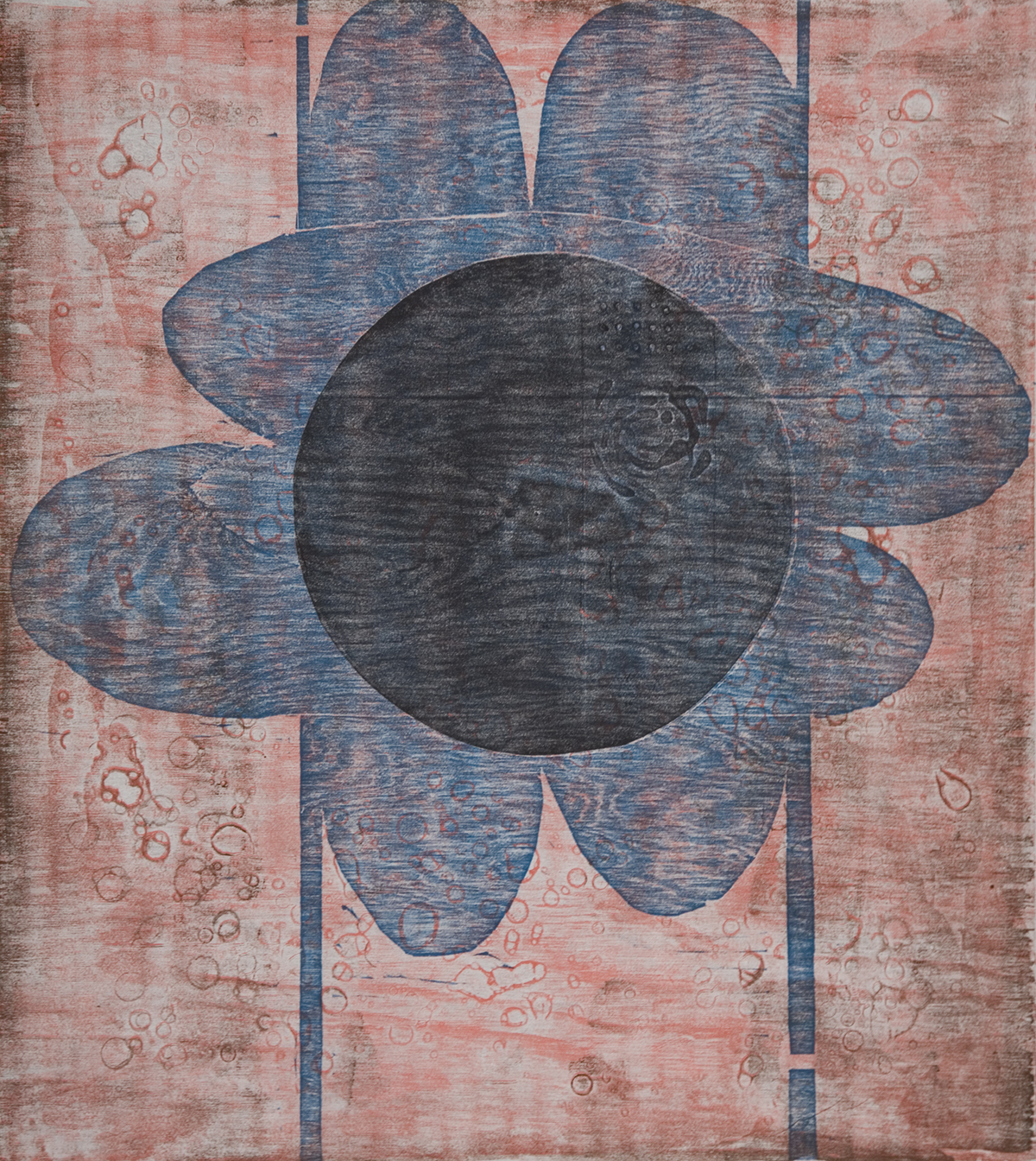 a woodblock print of a large blue flower with a black circular center. The background is pink. Two thin blue lines run vertically behind the flower. The wood grain can be seen over the whole print. 