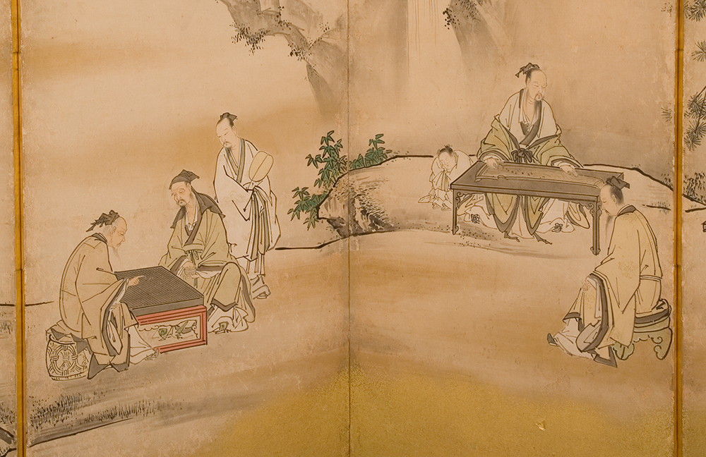 a close up of a scene on a large Japanese screen of people in traditional clothes playing Go