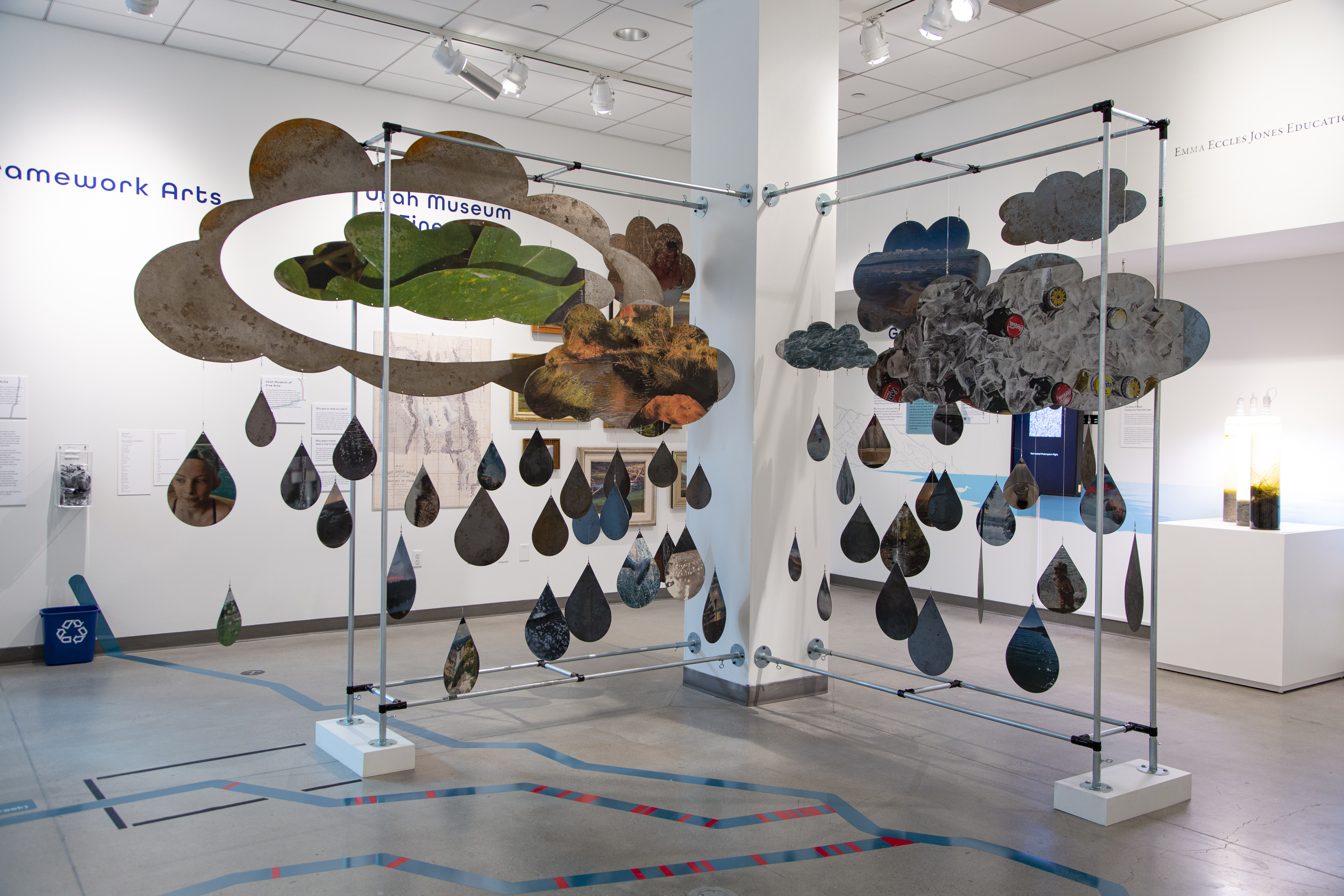 A hanging collage in the shape of clouds and water droplets at the UMFA.