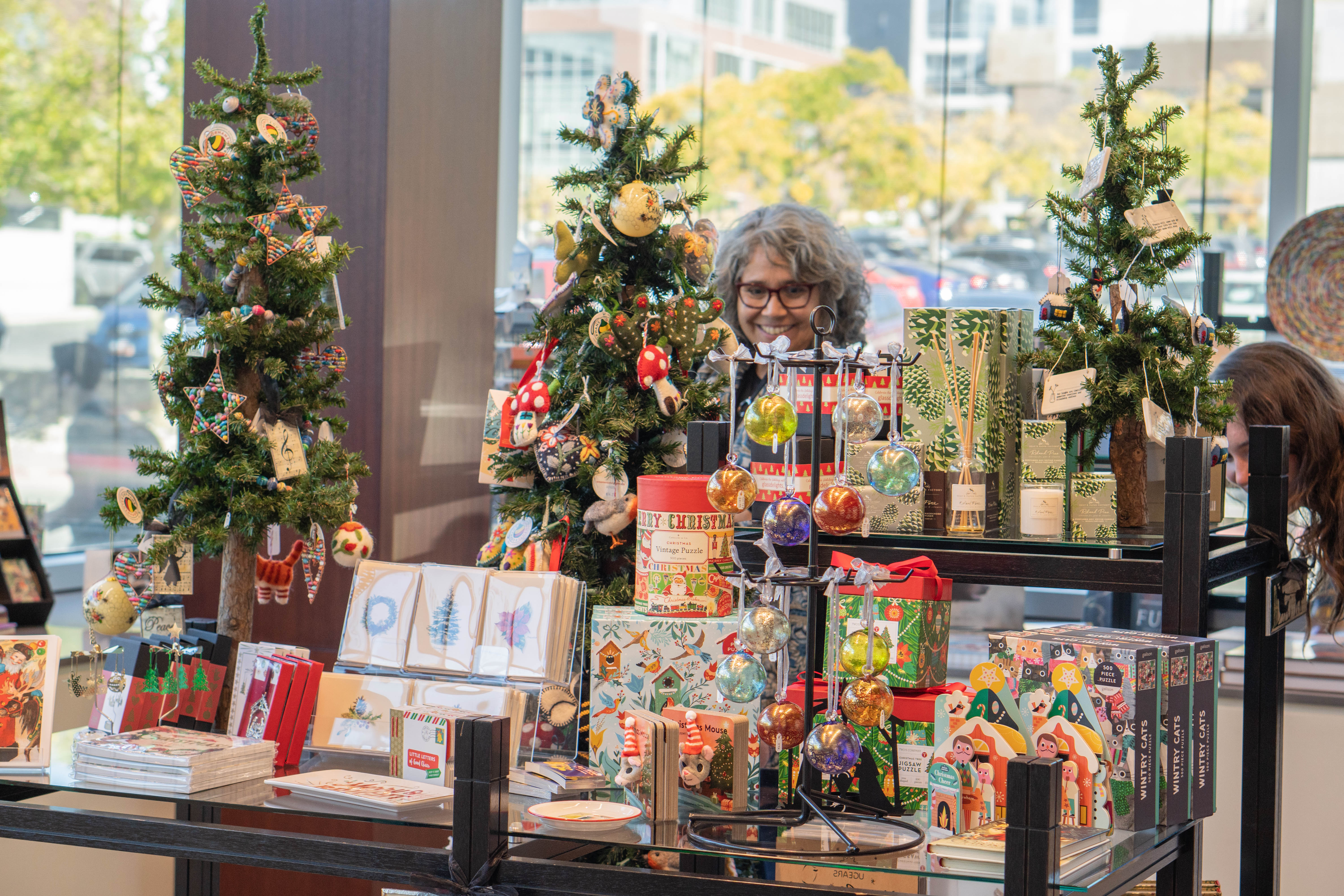 The museum store holiday display made of ornamented trees and tree themed cards and gift