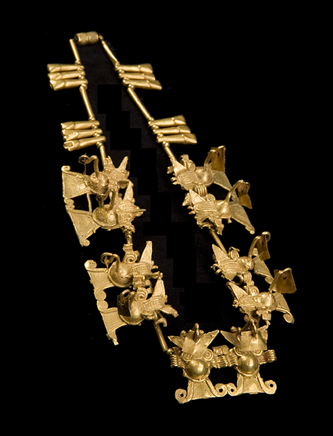 A golden necklace with bat effigies.