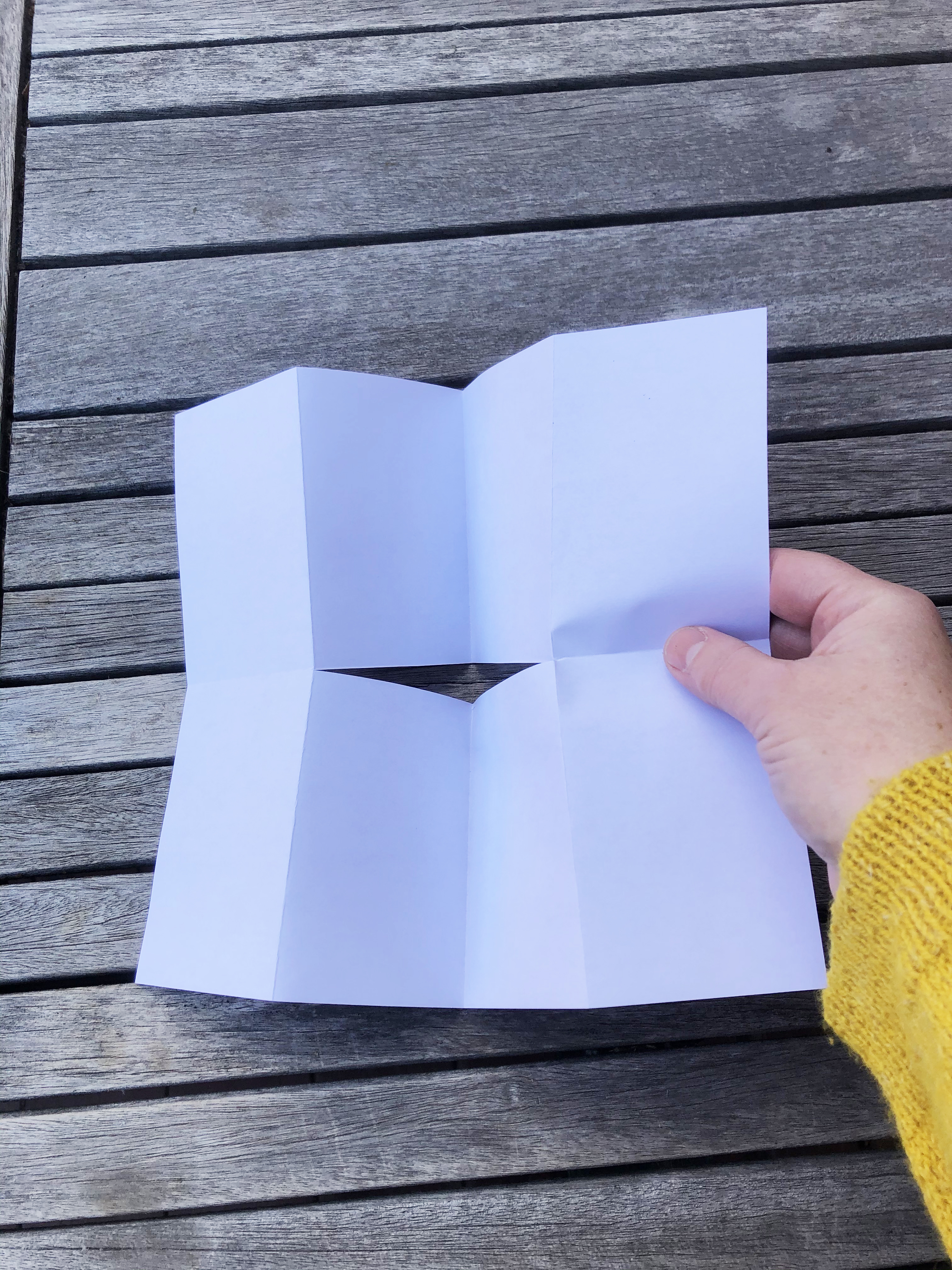 images of a white piece of paper with a cut in the center that does not reach the edges