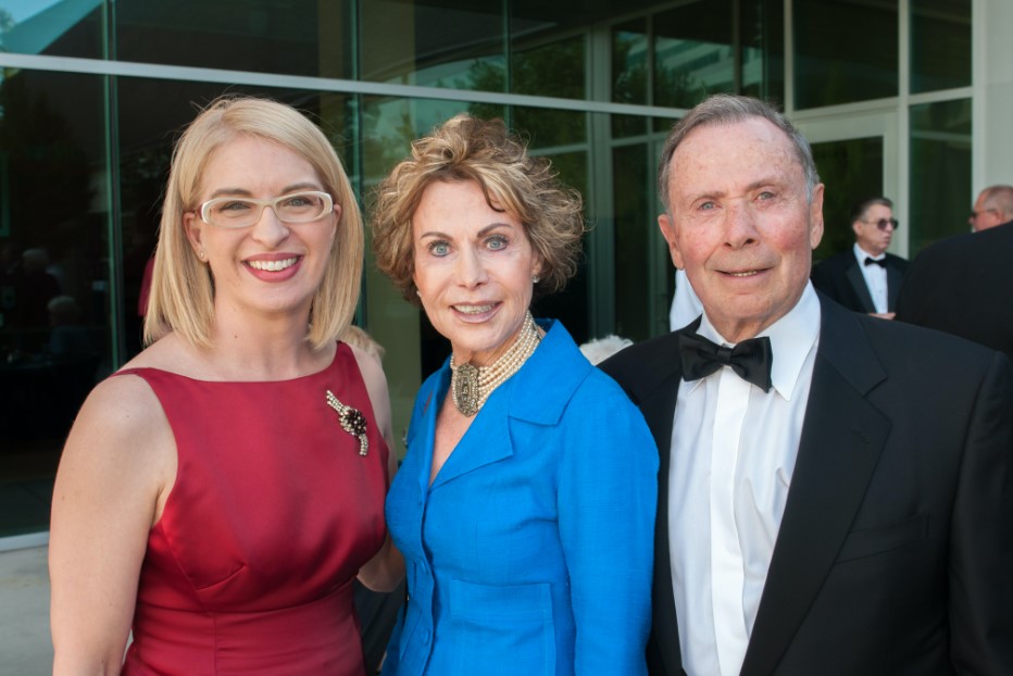 From left, Gretchen Dietrich, Marcia Price and John Price posing together outside the UMFA