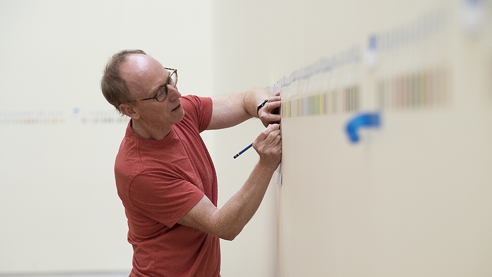 Spencer Finch installing Great Salt Lake and Vicinity in the UMFA Great Hall