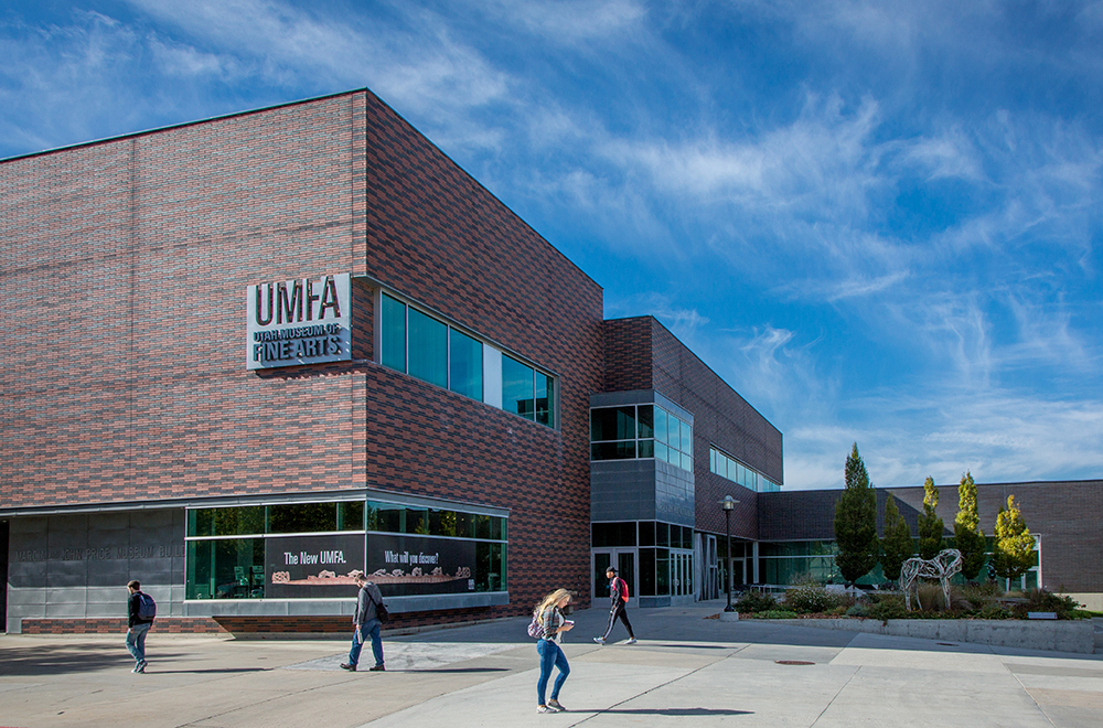 Utah Museum of Fine Arts exterior in summer students walking in front. 