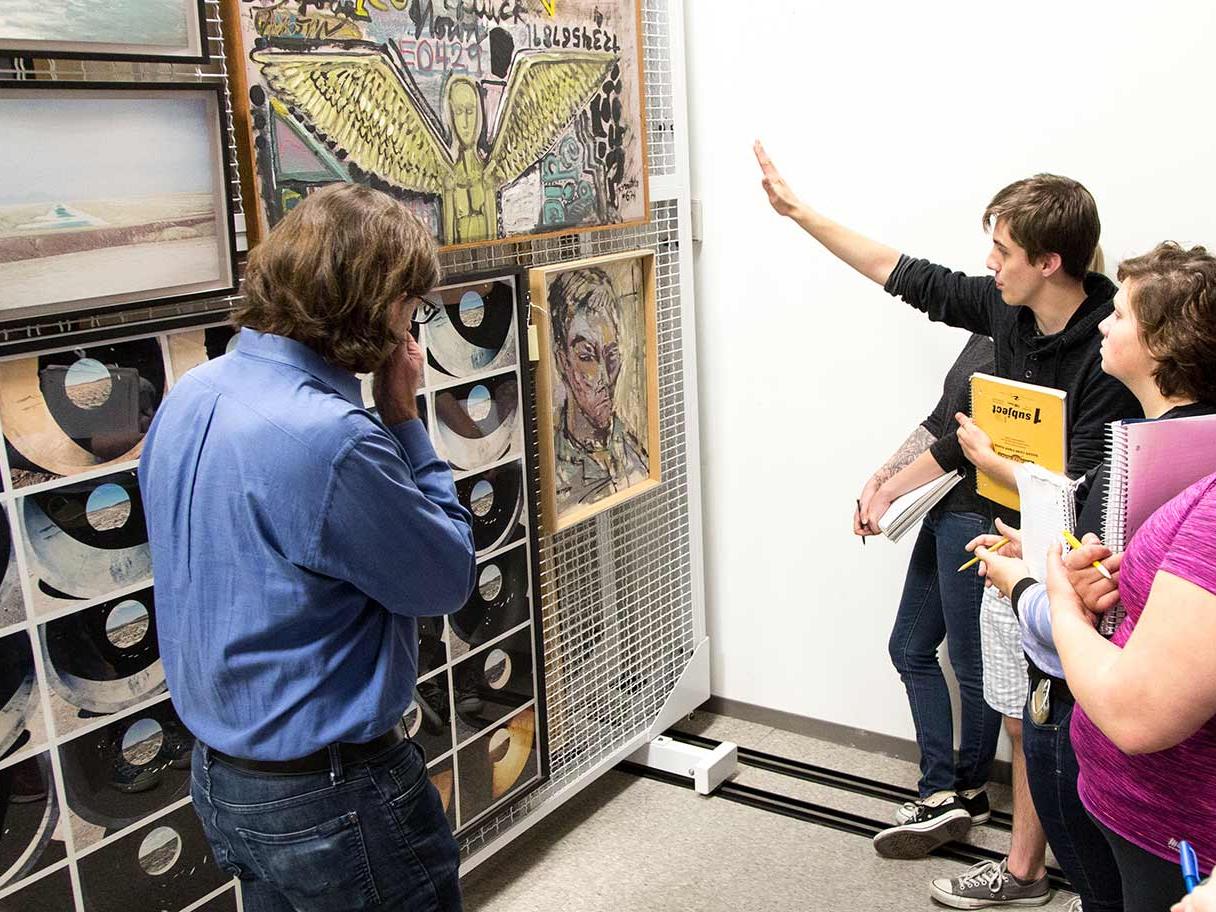 U of U Art History Professor Monty Perret and students discusses Robert Smithon's paintings in the UMFA's collections storage. U of U Art History Professor Monty Perret and students discusses Robert Smithon's paintings in the UMFA's collections storage.