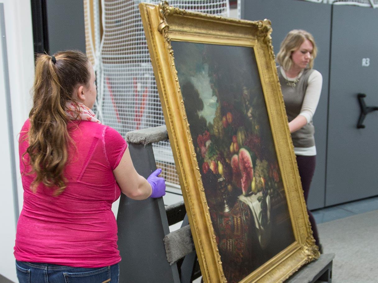 A student intern helping in the Collections department. 