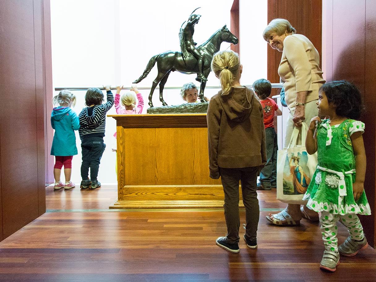 A UMFA docent educates young students about the collection.