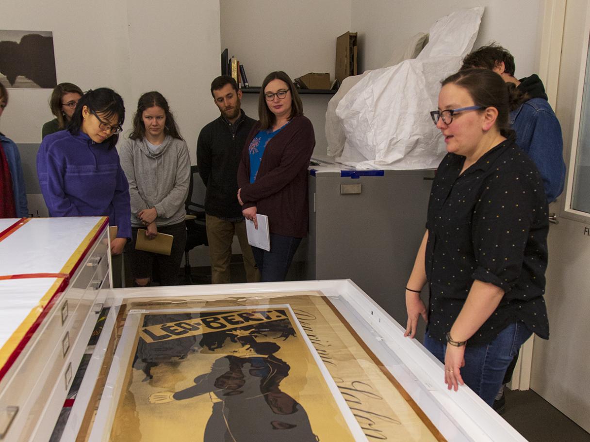 Students viewing objects in the UMFA's collection's storage. Students viewing objects in the Utah Museum of Fine Arts collection's storage.