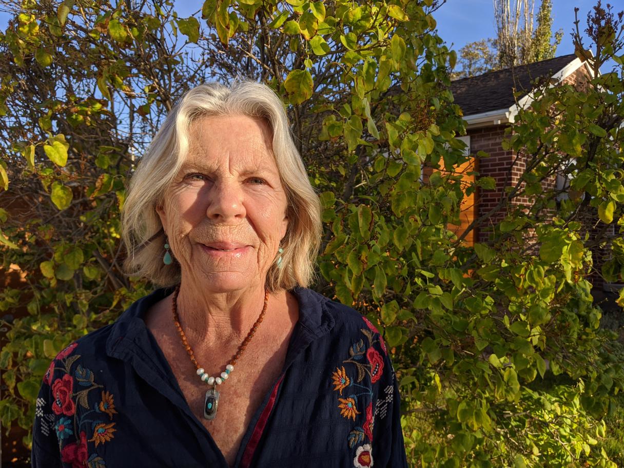 Marsha Christensen Marsha Christensen portrait in from on green bush