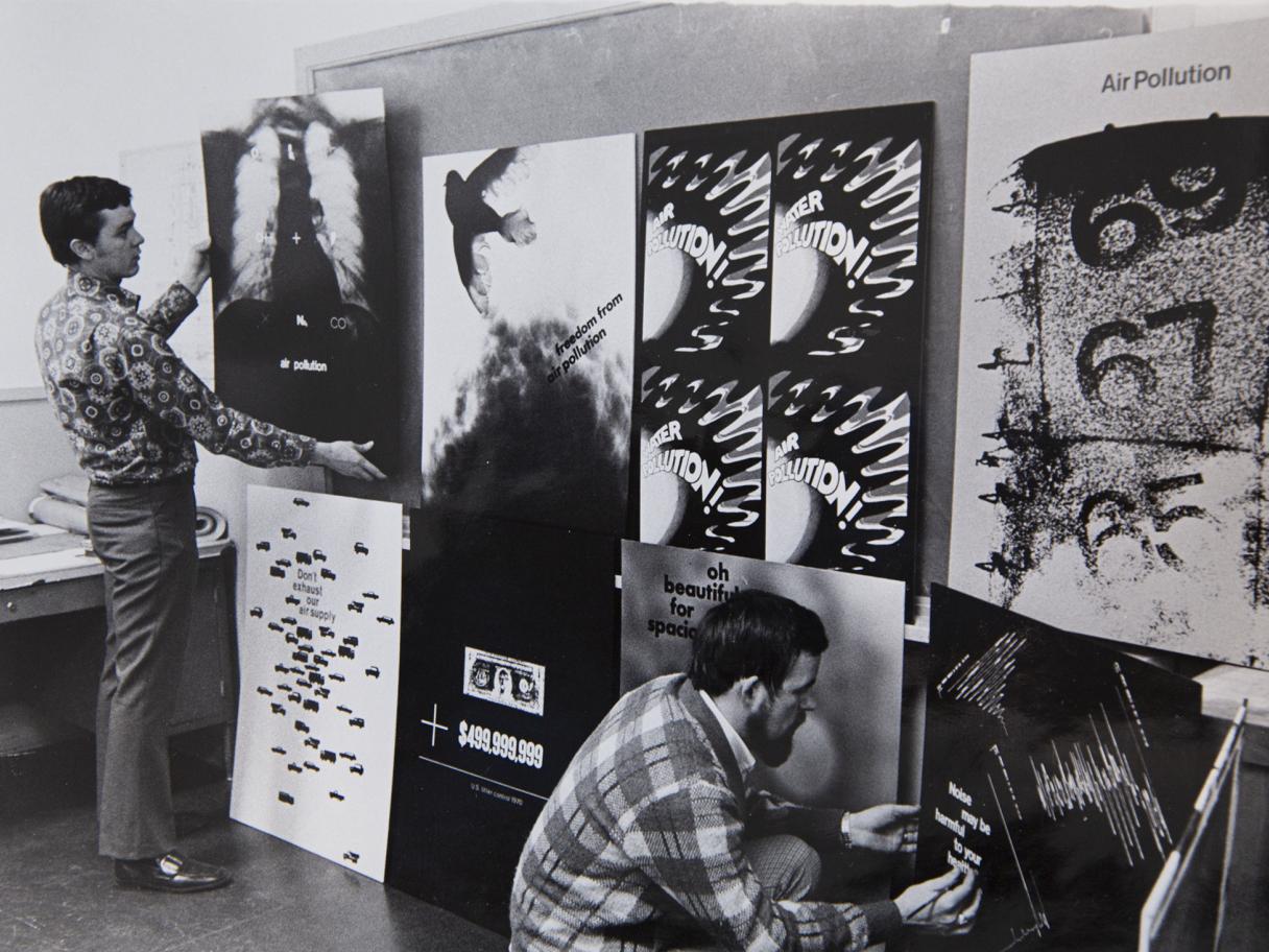 Graphic design students display their anti-pollution poster designs, 1970. University of Utah Archival Photograph Collection P0305, D – Art 1970-1979, Folder 1, No. 3. Special Collections, J. Willard Marriott Library, the University of Utah. 