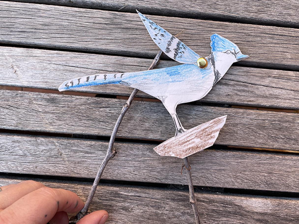 paper puppet of a blue bird