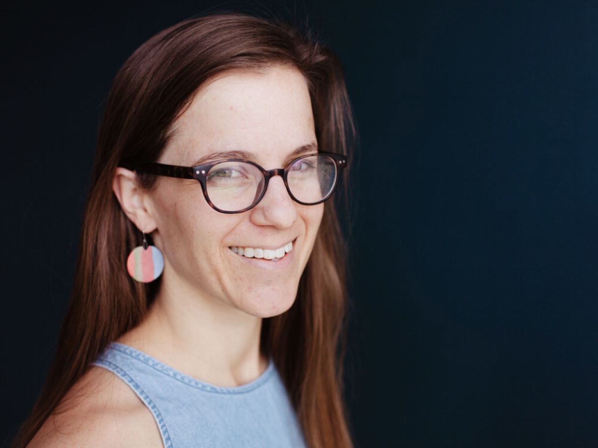 Amanda Green Amanda Green has long brown hair, thick rimmed glasses and is wearing a blue sleeveless top