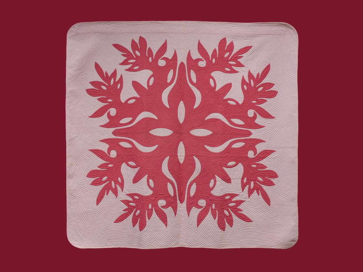 A large pink quilt with hot pink designs on a burgundy background.