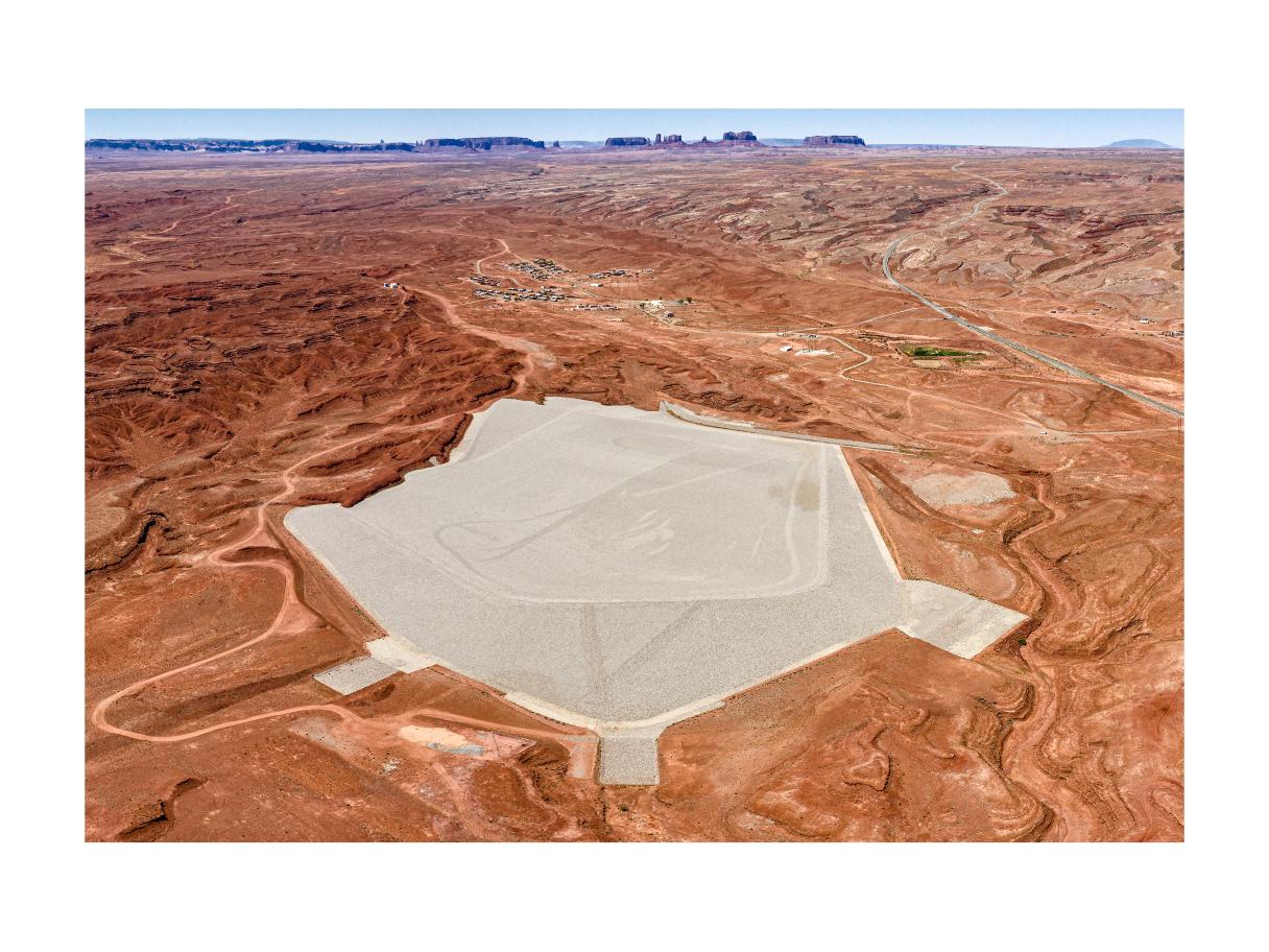 A drone shot of a massive filled hexagon in an orange desert.