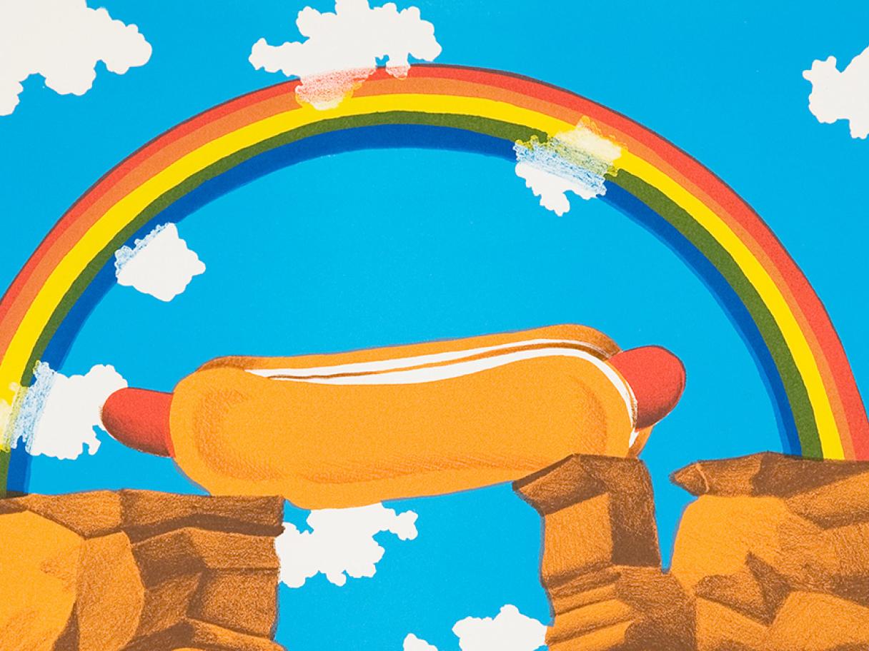 A bright hot dog between two cliff with a rainbow above