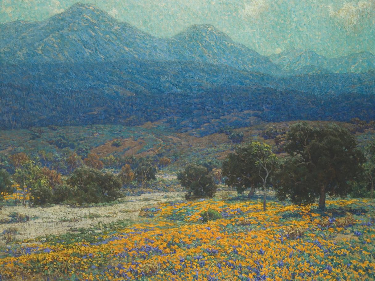 A painting of a field of yellow flowers with blue mountains looming in the distance.