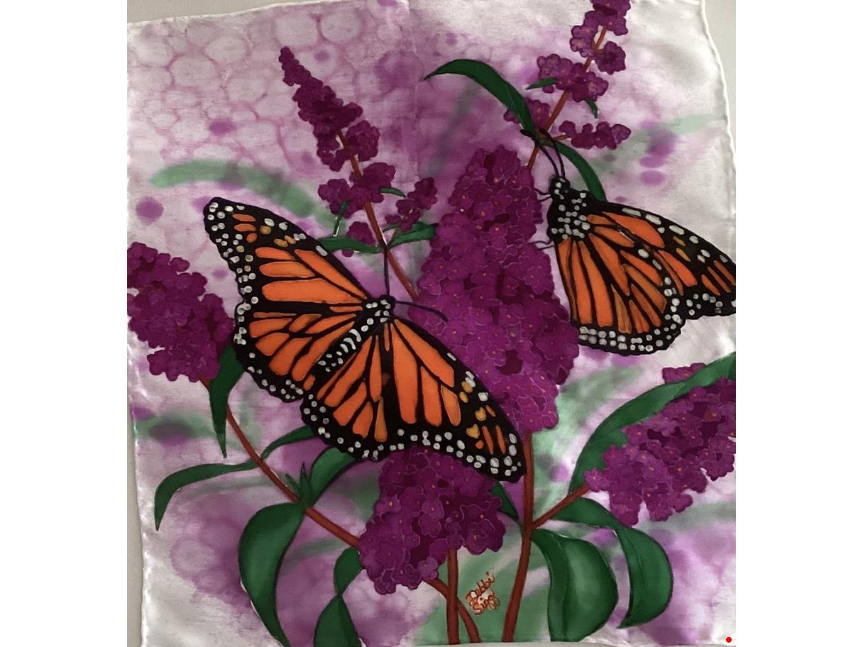 A hand-painted scarf featuring two orang monarch butterflies and dark purple lavendar.