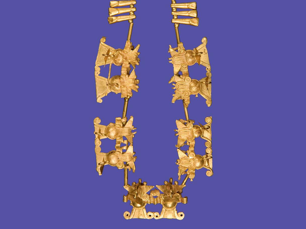 A golden necklace with bat effigies.
