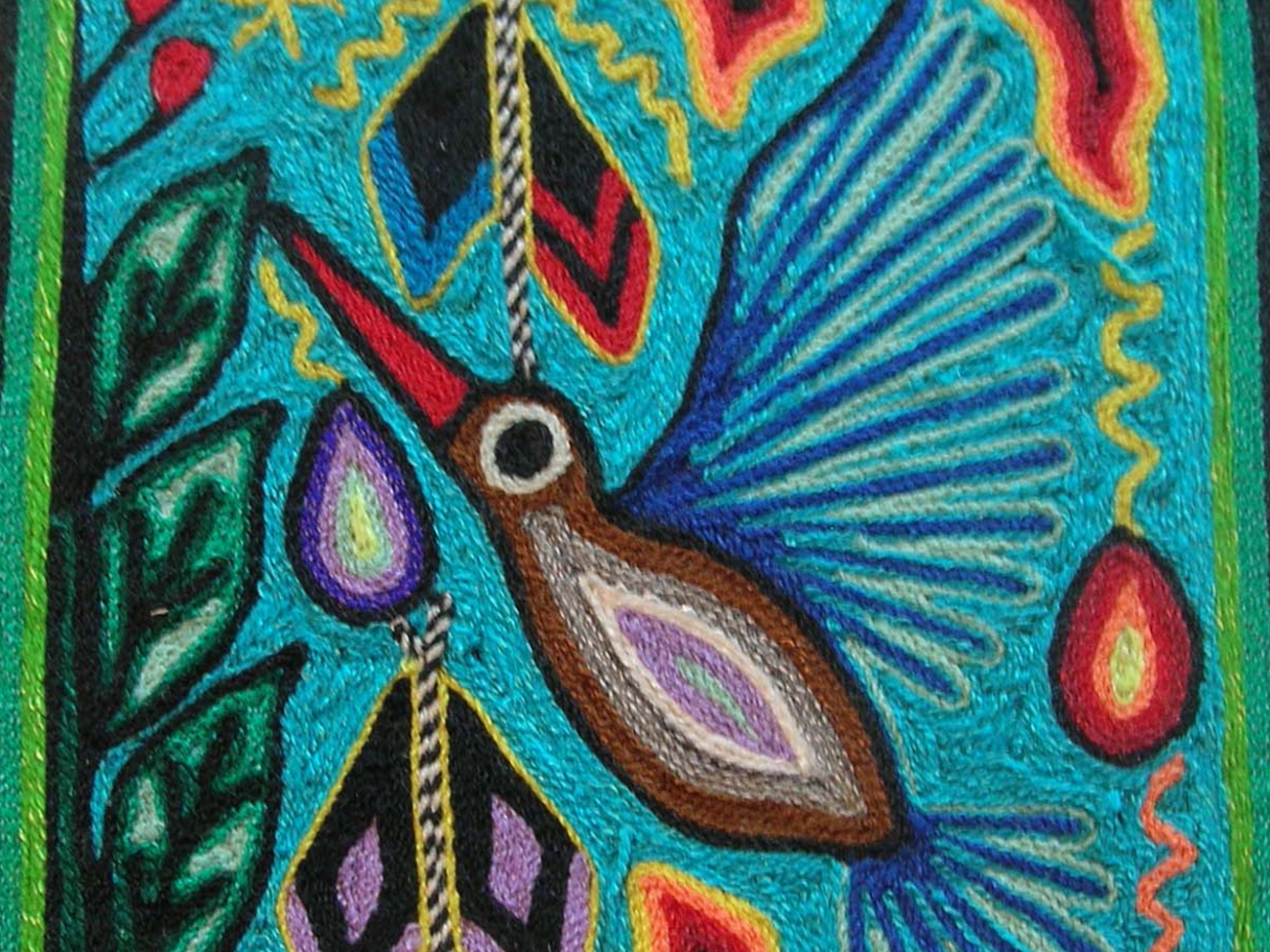 A colorful yarn painting of a hummingbird.