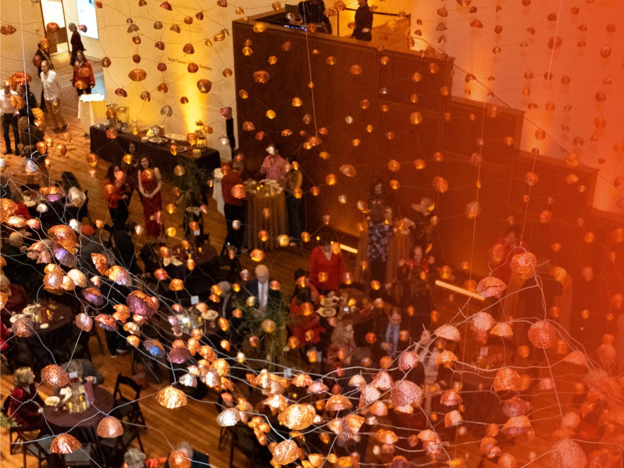 The UMFA Great Hall with the installation Stone on Boundary and party goers mingling.
