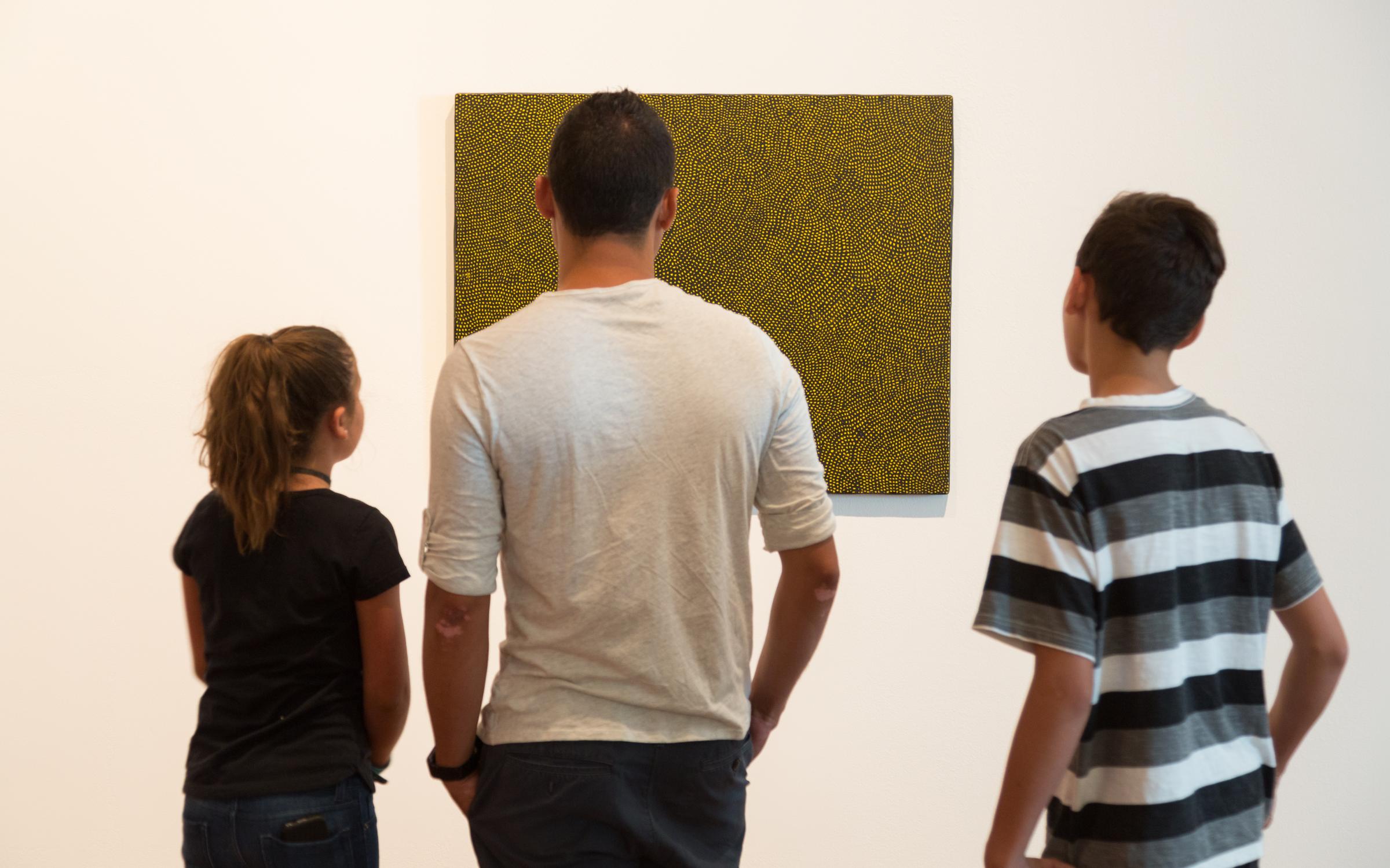 Third Saturday Highlights Tour December Families examining modern and contemporary art at the UMFA