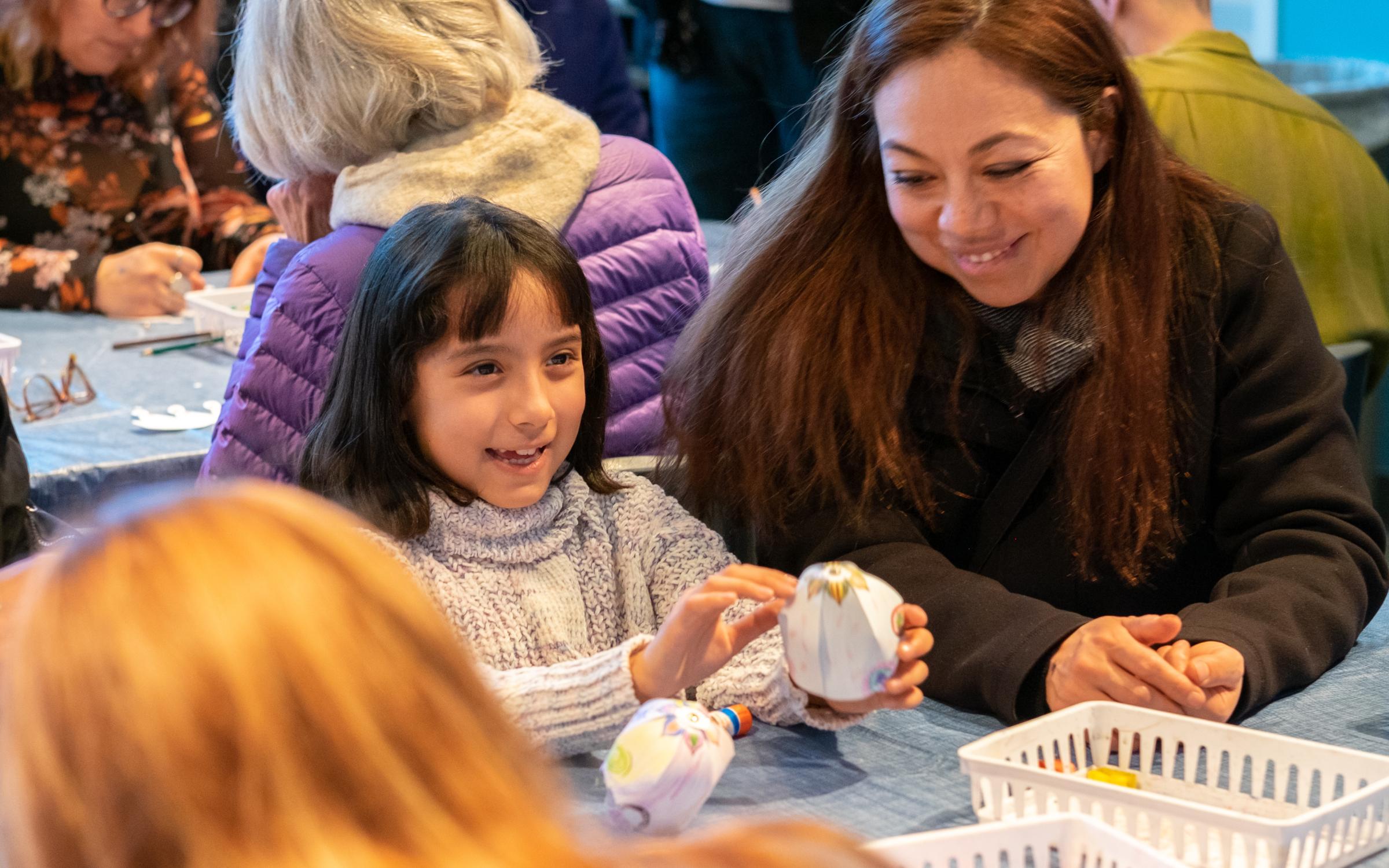 Let's make clay sculptures together A mother and daughter in an art making activity