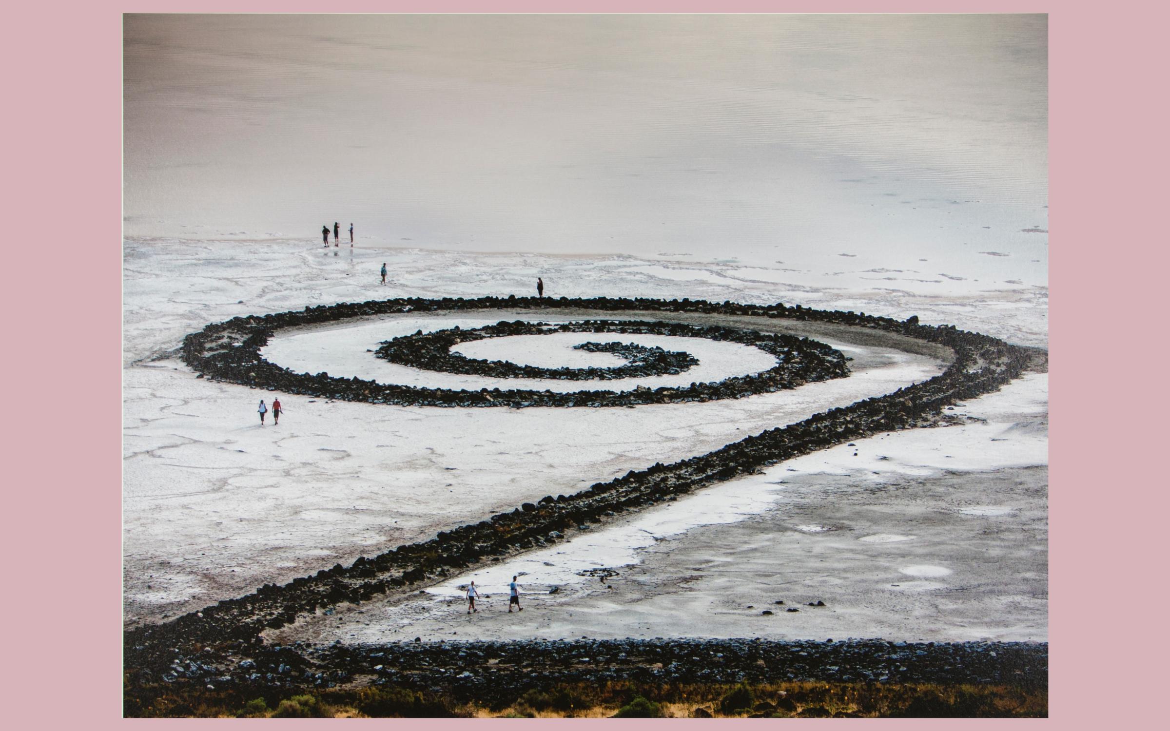 a birds eye view of the spiral jetty in winter