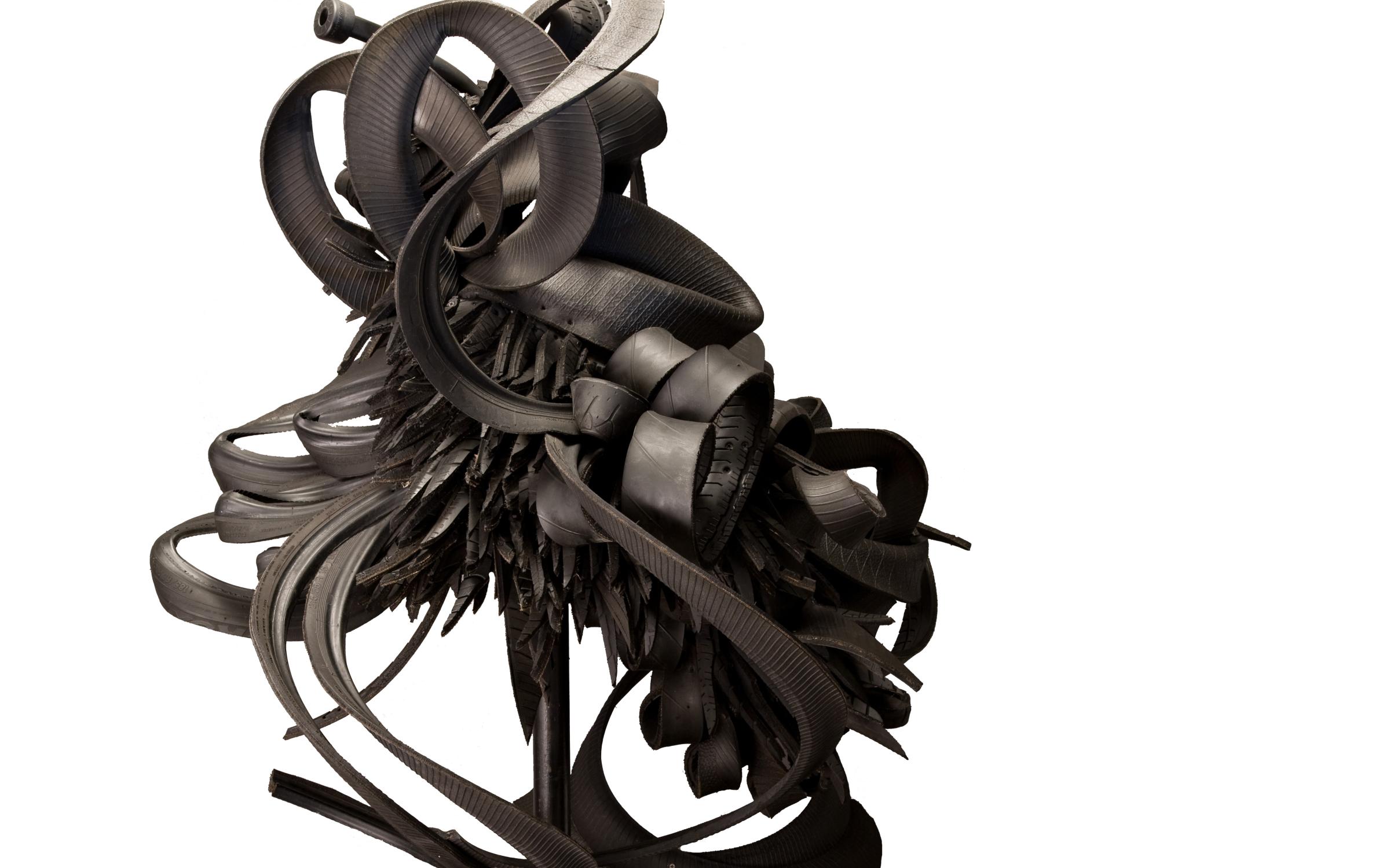 Discarded Memories by Chakaia Booker A large black sculpture made from recycled tires.
