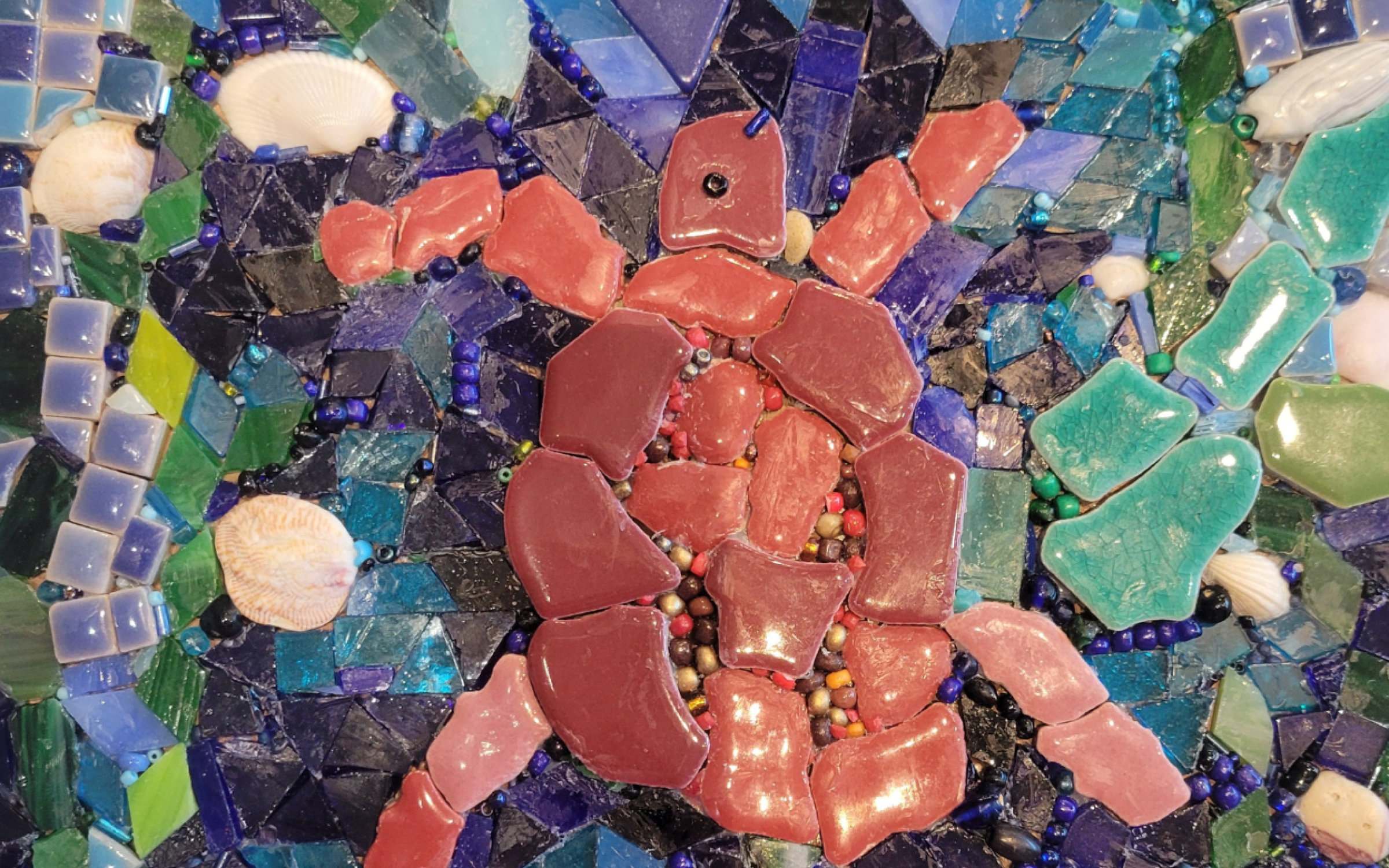 A mosaic of a red turtle.