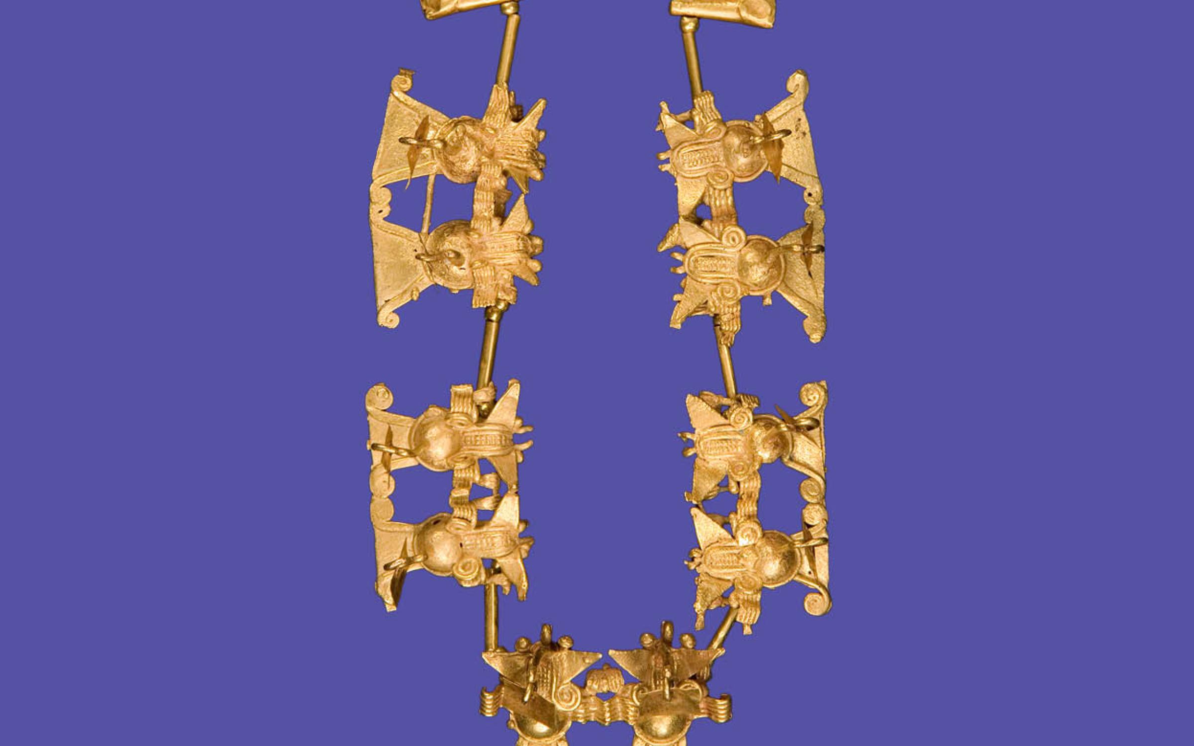 A golden necklace with bat effigies.