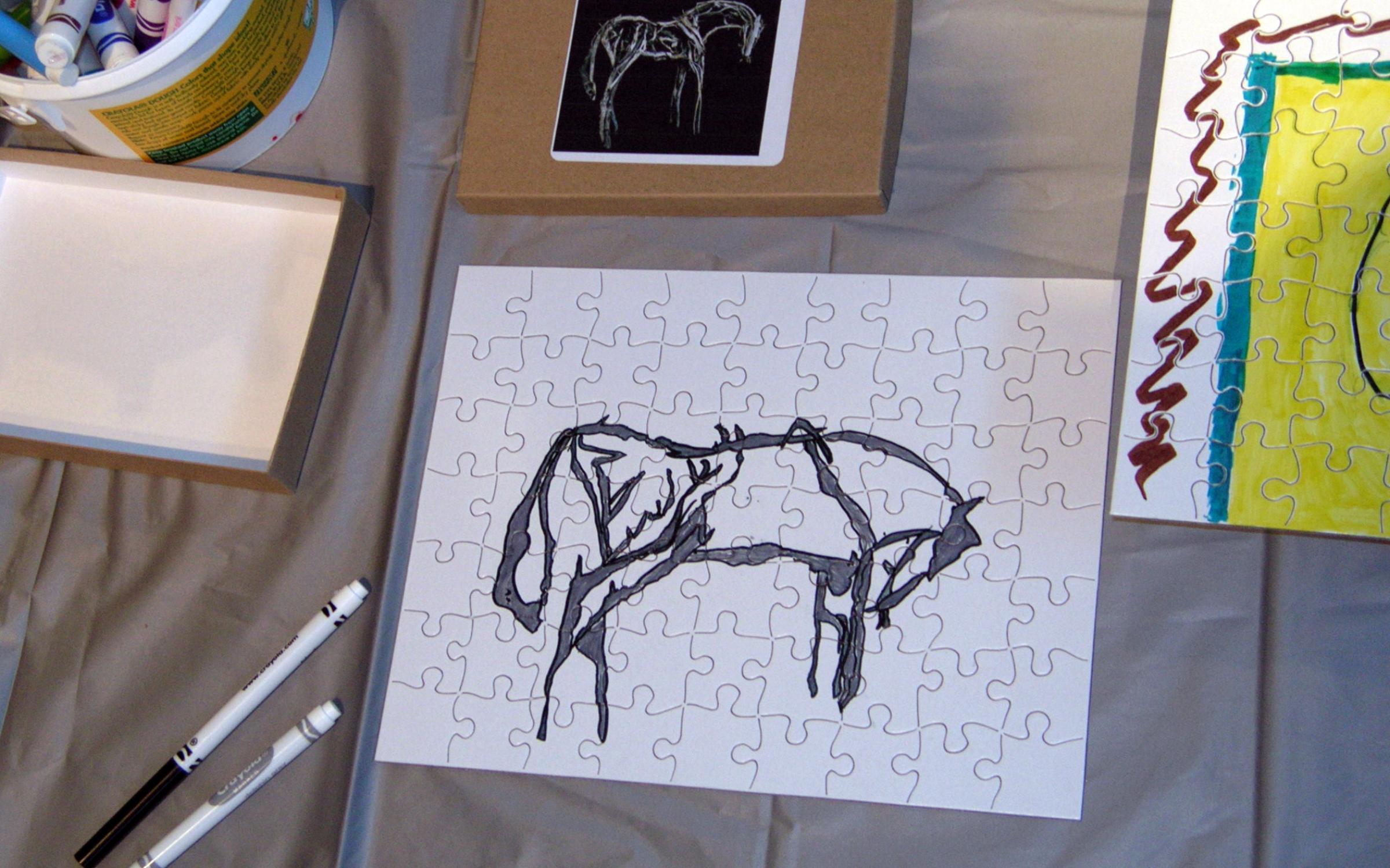 Pattern Puzzles A white puzzle with a horse drawn in black marker.