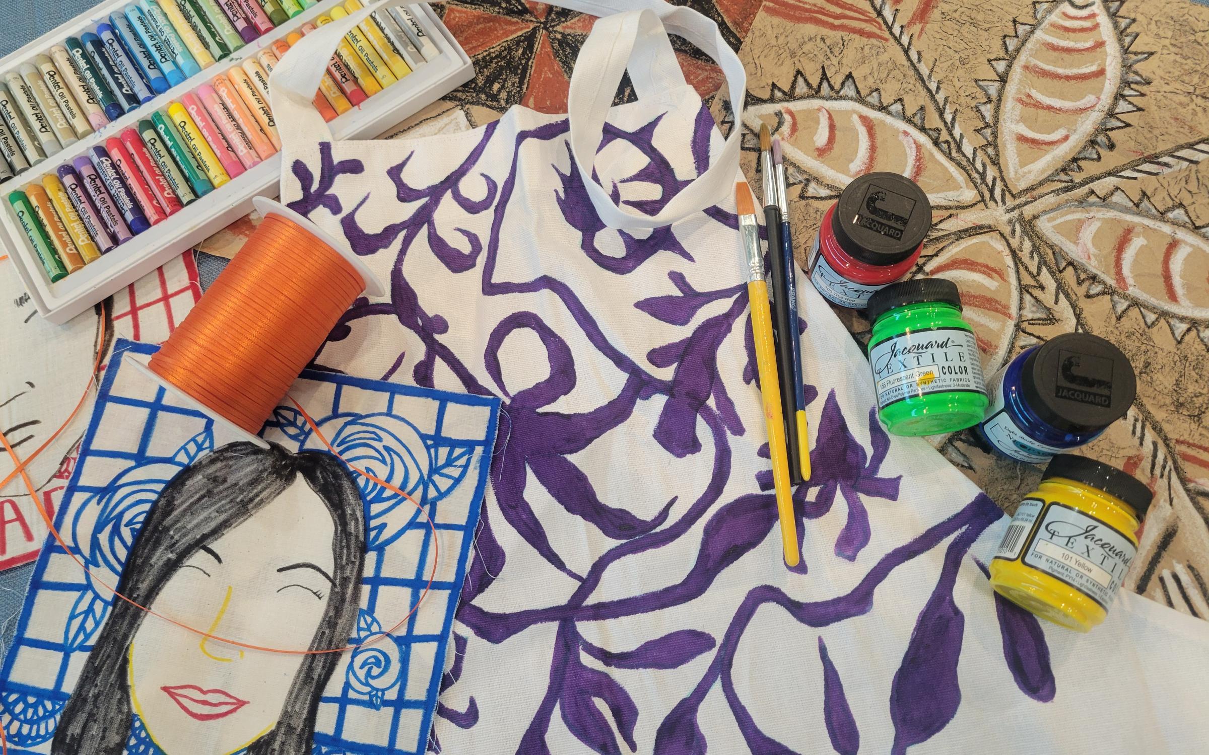 Be Creative A collection of art projects and art supplies scattered on a table.