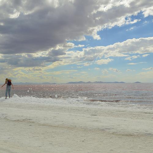 Visitors exploring Great Salt Lake shoreline at Rozel Point.