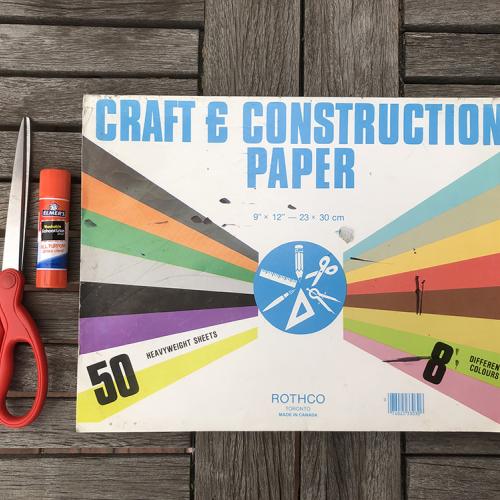 Colored craft paper, scissors and glue