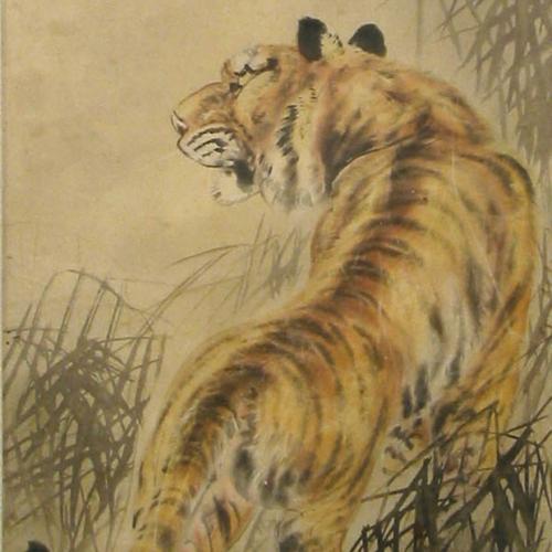 A yellow and brown tiger. The tiger is looking away from the viewer and is walking among green bamboo plants. 