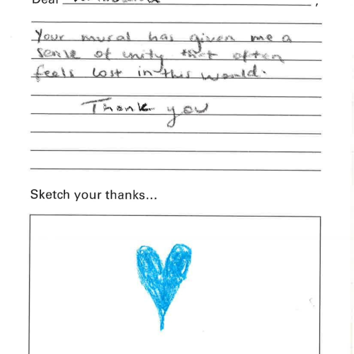 A letter addressed to the mural "Blackness Brings Forth Life". The letter reads "Dear Vaimoana, Your mural has given me a sense of unity that often feels lost in this world. Thank you." There is a simple drawing of a blue heart and the letter is signed "Ariana."