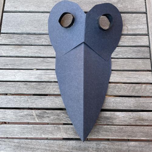 Everything glued together to create a bird mask shape