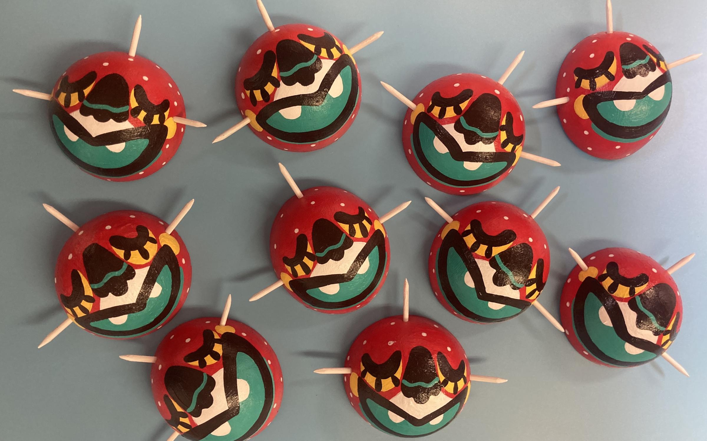 A collection of colorful round masks.