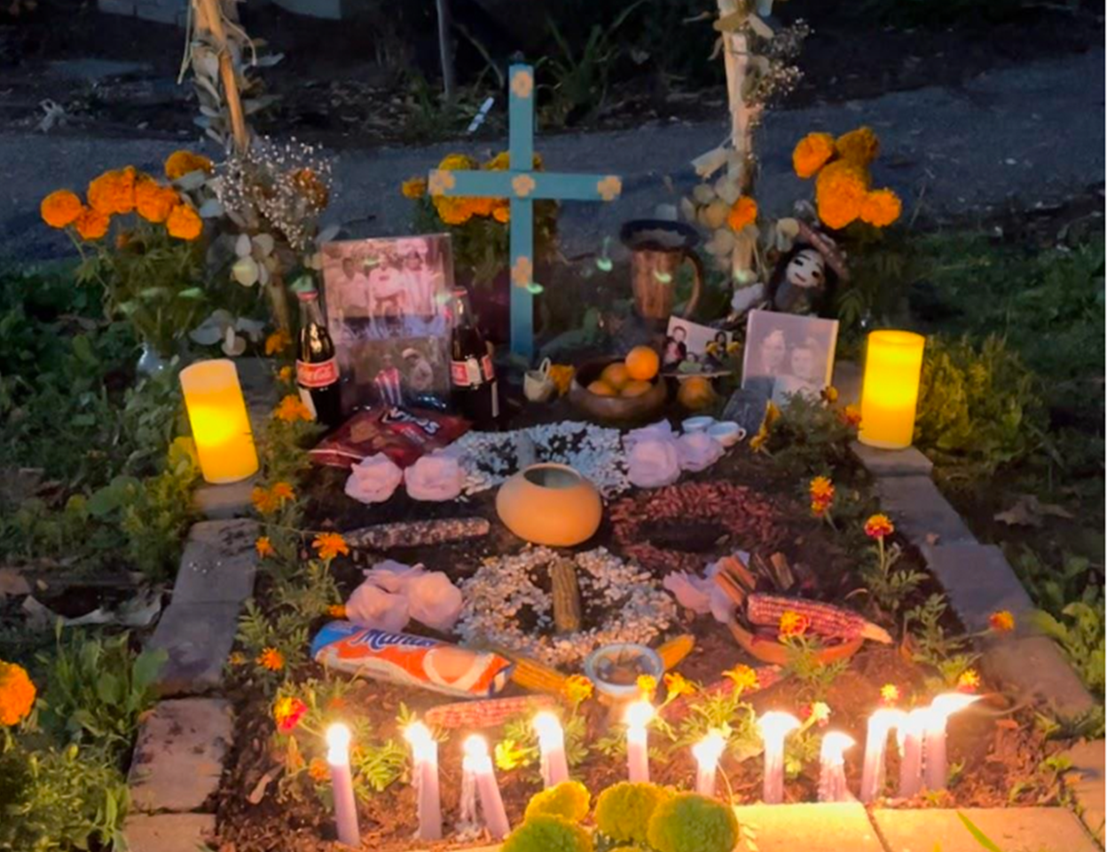 A colorful collection of offerings and candles.