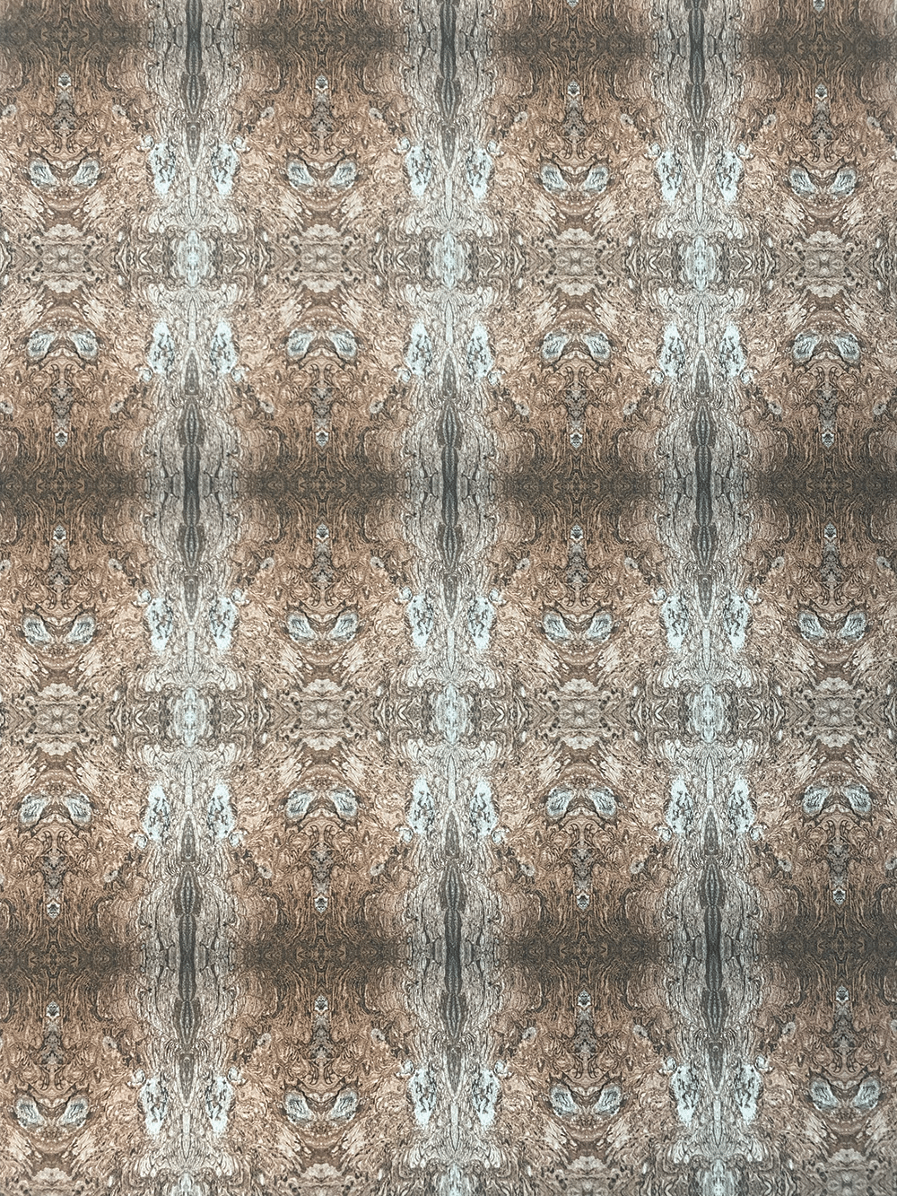 Close-up of a symmetrical, repeating pattern resembling wood grain with brown, tan, and gray hues. The design forms mirrored, intricate shapes that create a textured, almost kaleidoscopic visual effect.